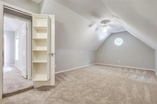 a view of an empty room with a fireplace