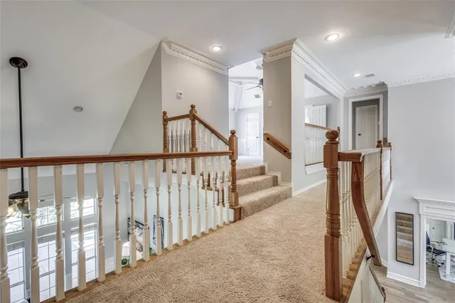 a view of a hallway with staircase
