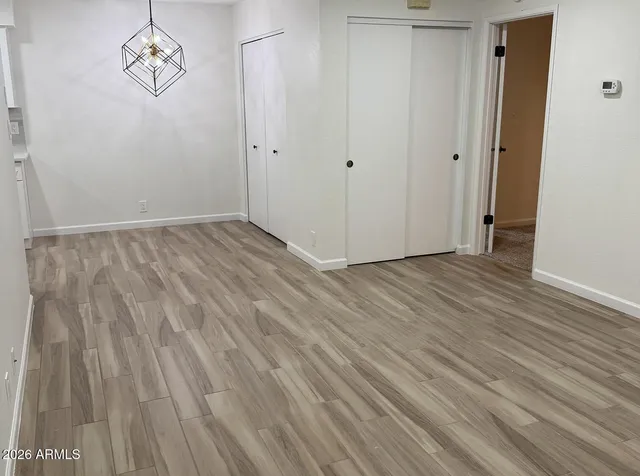 a view of room with wooden floor