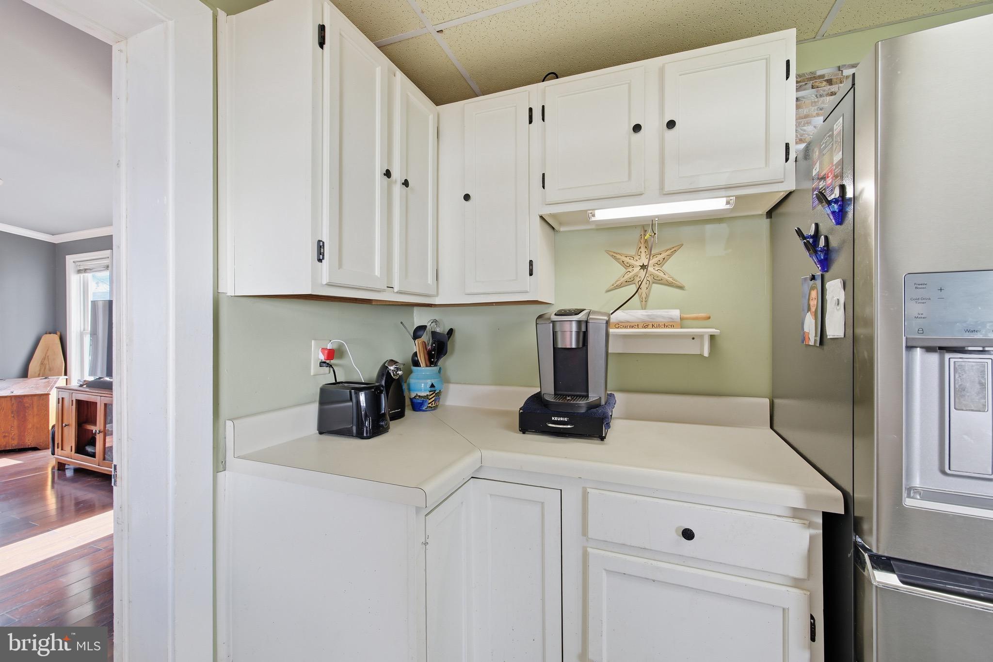 24295 Senedo Road Woodstock, VA 22664 - Photo 15 of 43 a kitchen with refrigerator and cabinets