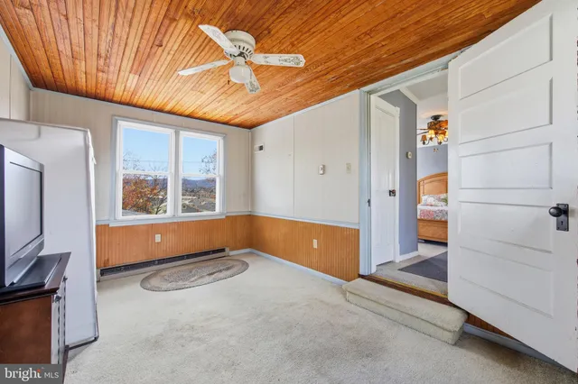 a view of an entryway with a carpet