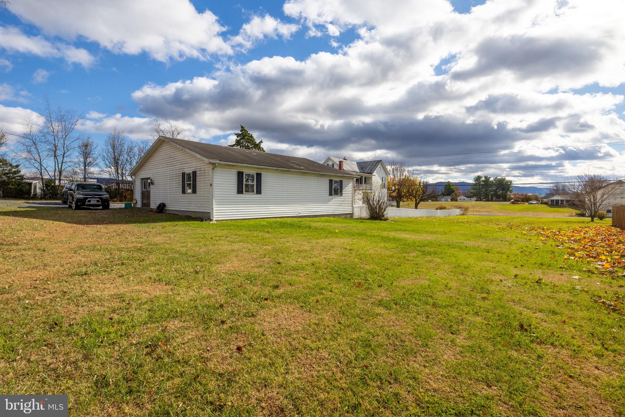 24295 Senedo Road Woodstock, VA 22664 - Photo 34 of 43 a view of a swimming pool with an outdoor seating and a yard