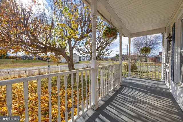 a view of a balcony with wooden floor