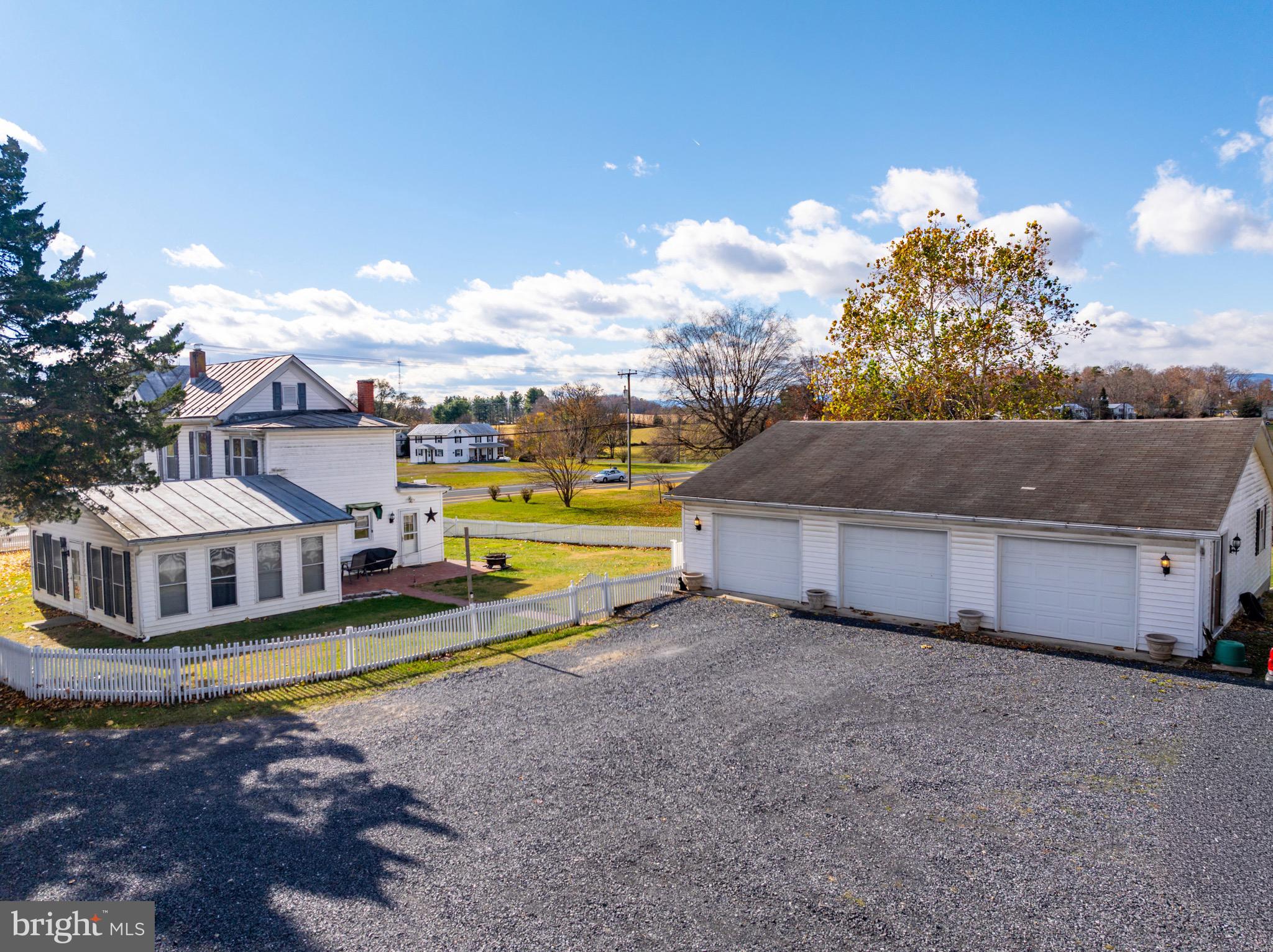 24295 Senedo Road Woodstock, VA 22664 - Photo 8 of 43 a view of a house with swimming pool and a yard
