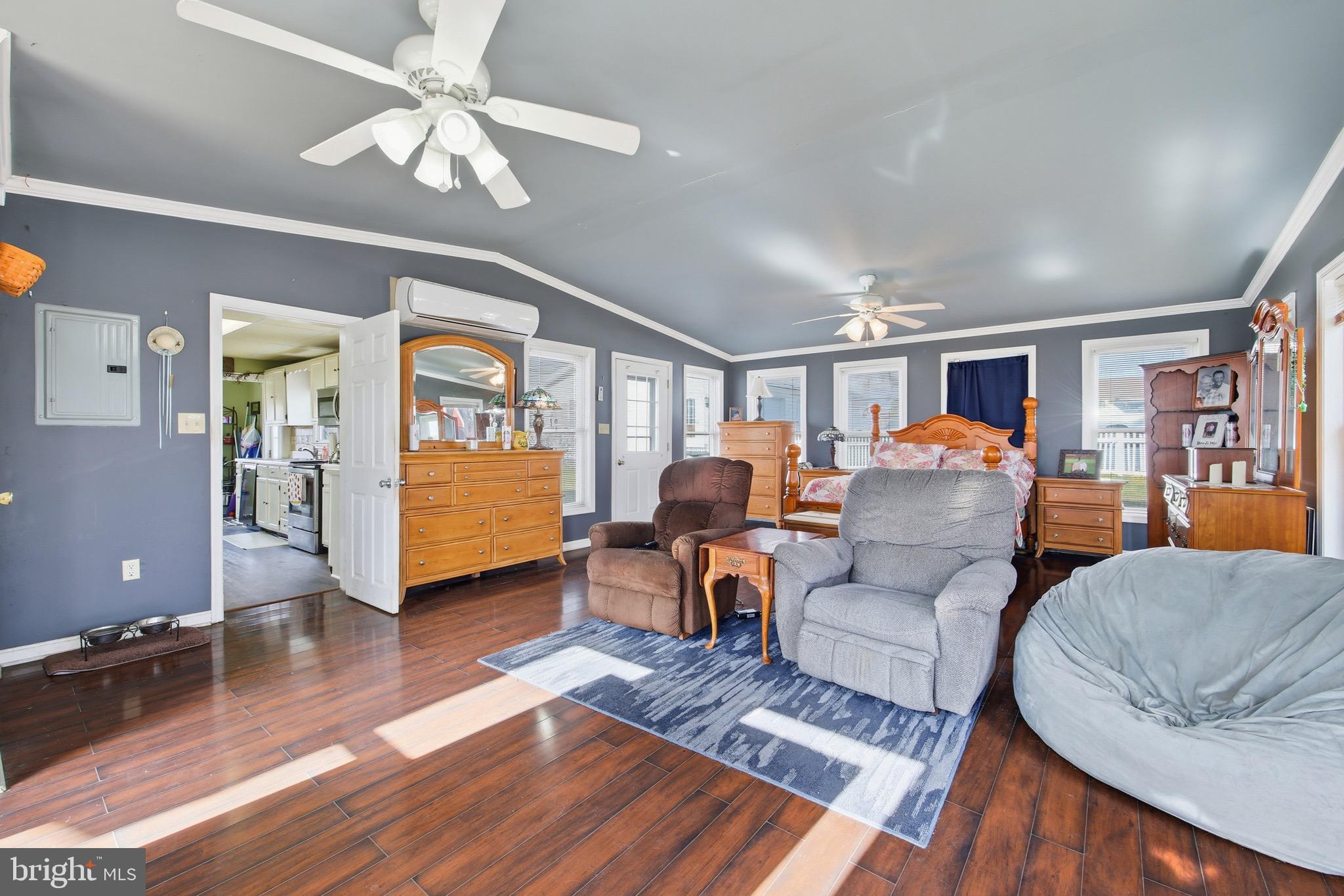 24295 Senedo Road Woodstock, VA 22664 - Photo 10 of 43 a living room with furniture and a to ceiling window