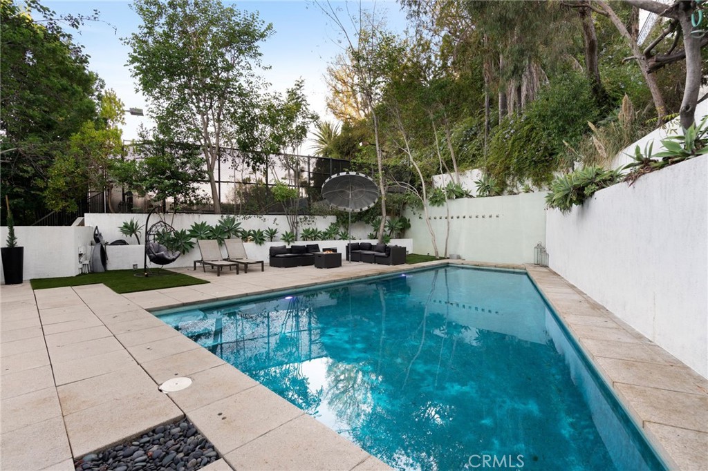 1447 North Kings Road West Hollywood, CA 90069 - Photo 14 of 40 a view of a swimming pool with a patio