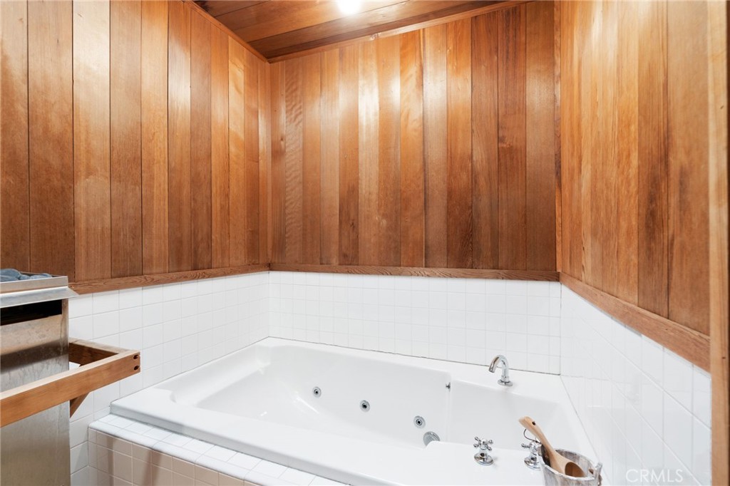 1447 North Kings Road West Hollywood, CA 90069 - Photo 21 of 40 a bathroom with a bathtub and shower