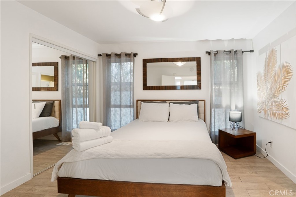 1447 North Kings Road West Hollywood, CA 90069 - Photo 22 of 40 a bedroom with a bed and a couch