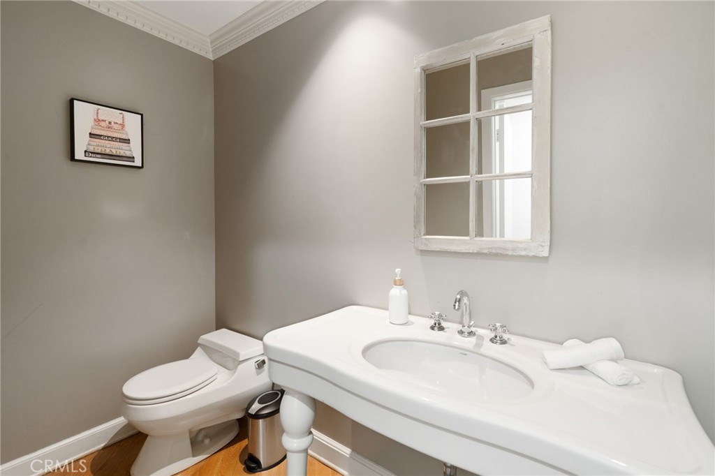 1447 North Kings Road West Hollywood, CA 90069 - Photo 29 of 40 a bathroom with a sink and a toilet