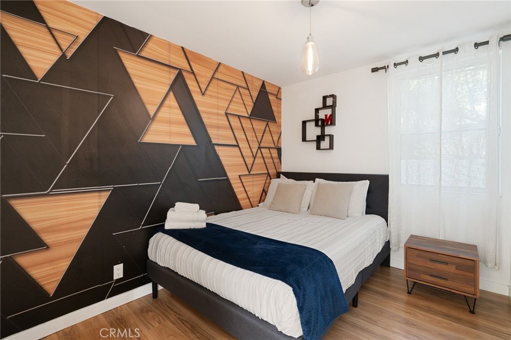 1447 North Kings Road West Hollywood, CA 90069 - Photo 31 of 40 a bedroom with a bed and a dresser