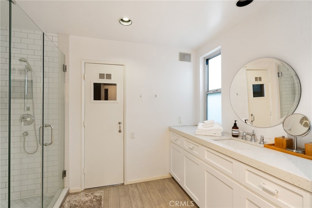 1447 North Kings Road West Hollywood, CA 90069 - Photo 33 of 40 a bathroom with a sink and a mirror