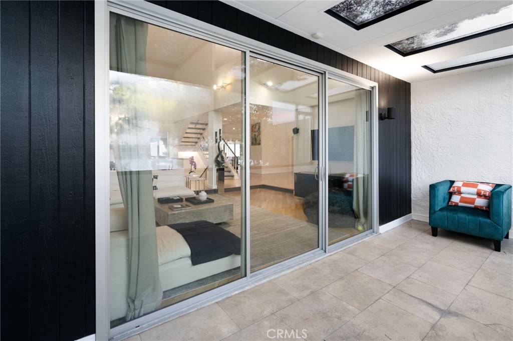 1447 North Kings Road West Hollywood, CA 90069 - Photo 35 of 40 a view of a hallway with living room and furniture