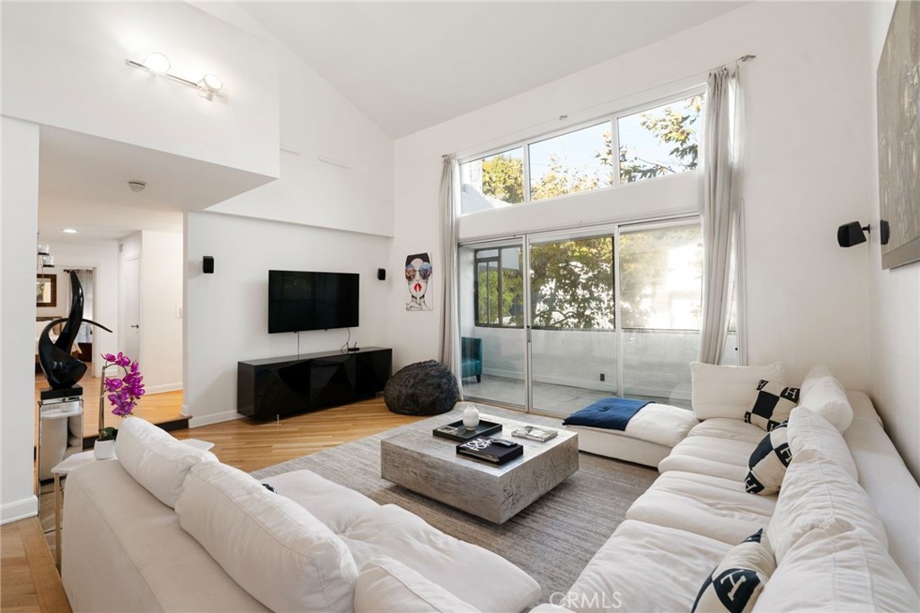 1447 North Kings Road West Hollywood, CA 90069 - Photo 4 of 40 a living room with furniture and a flat screen tv