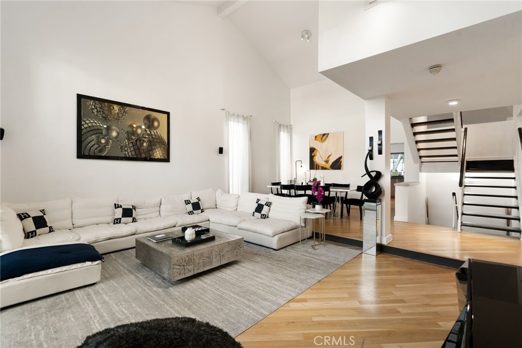 1447 North Kings Road West Hollywood, CA 90069 - Photo 6 of 40 a living room with furniture and wooden floor