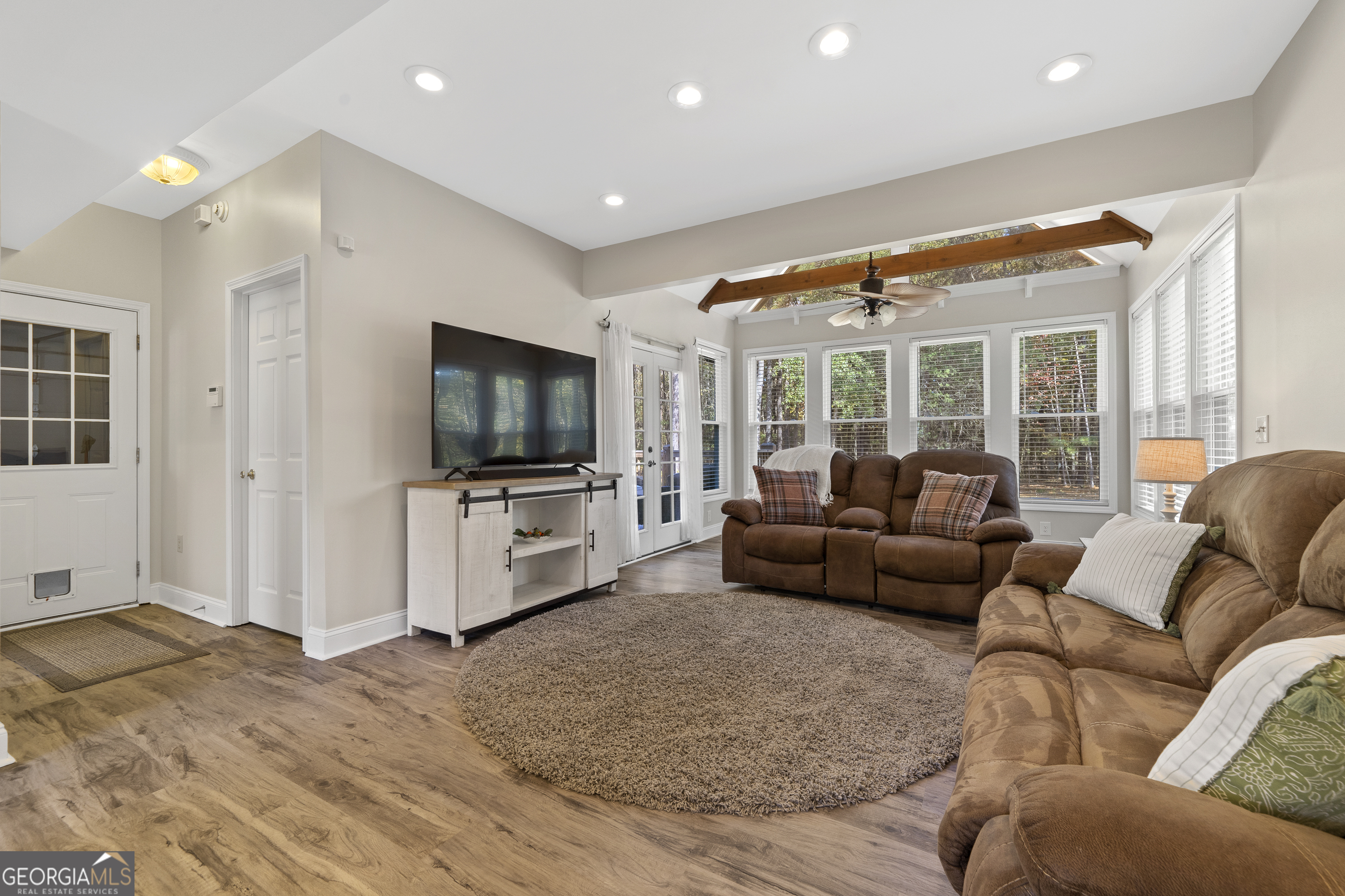 1050 Sugar Creek Church Road Madison, GA 30650 - Photo 18 of 60 a living room with furniture and a flat screen tv
