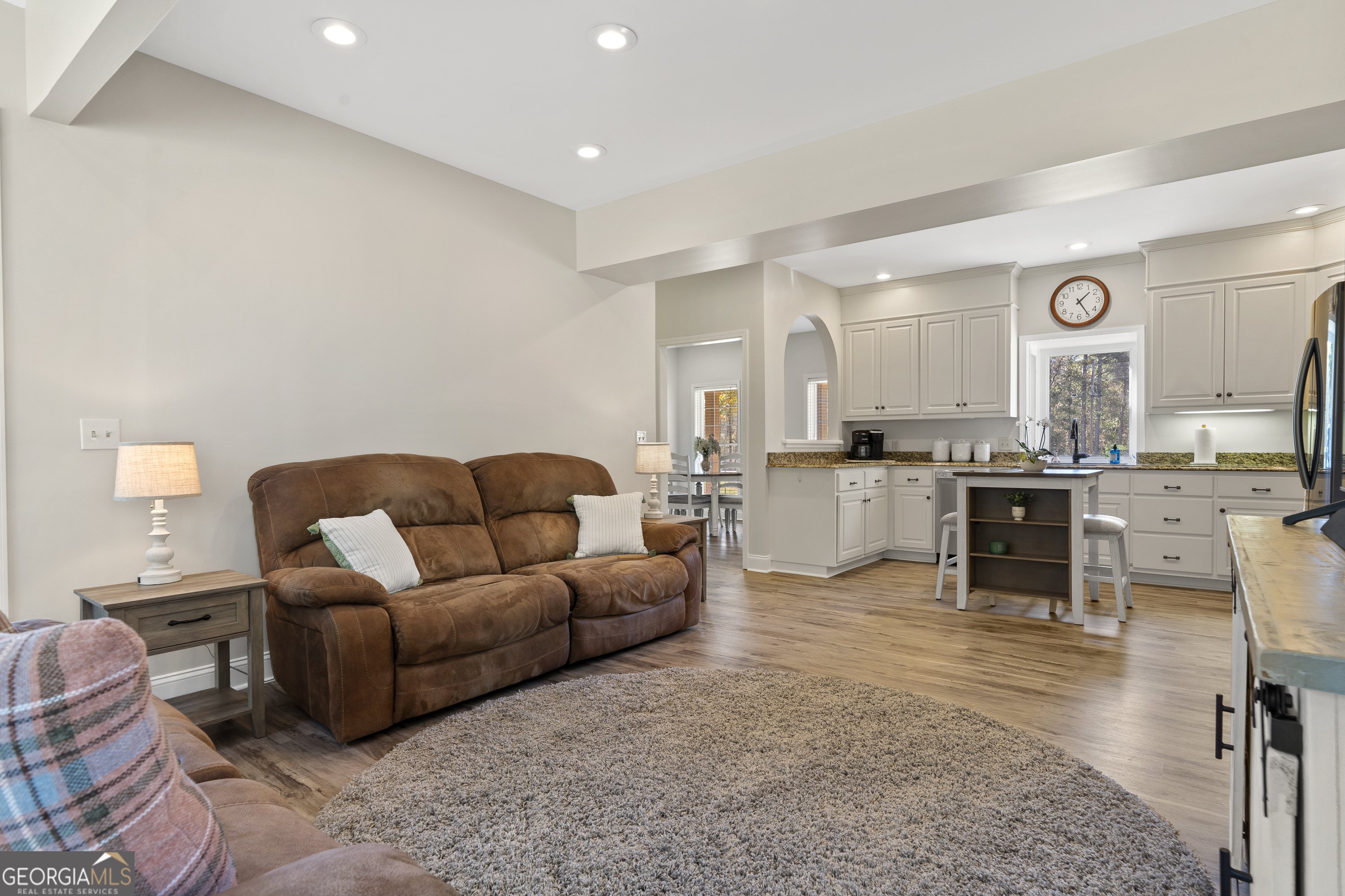 1050 Sugar Creek Church Road Madison, GA 30650 - Photo 19 of 60 a living room with furniture and kitchen view