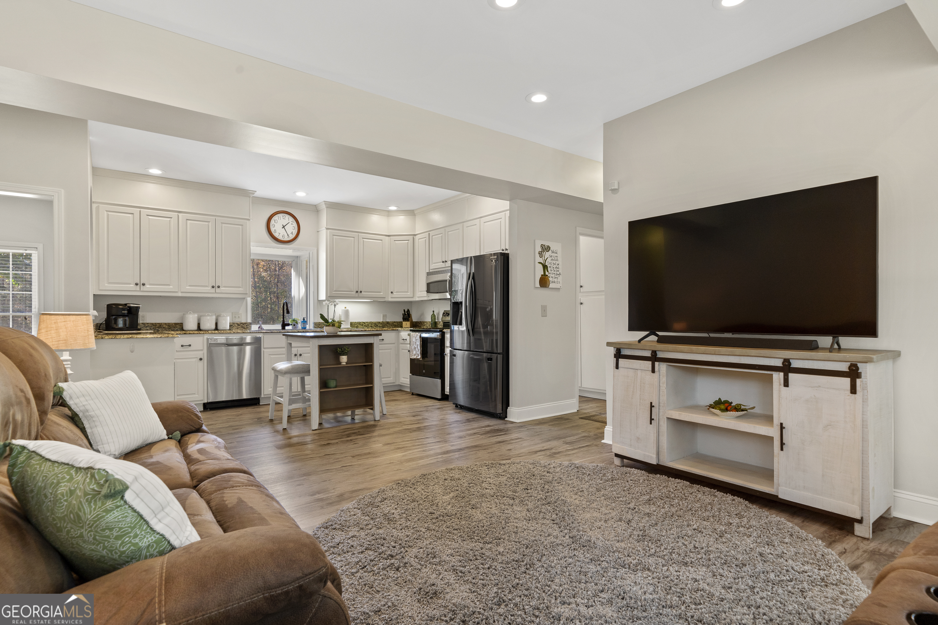 1050 Sugar Creek Church Road Madison, GA 30650 - Photo 20 of 60 a living room with furniture and a flat screen tv