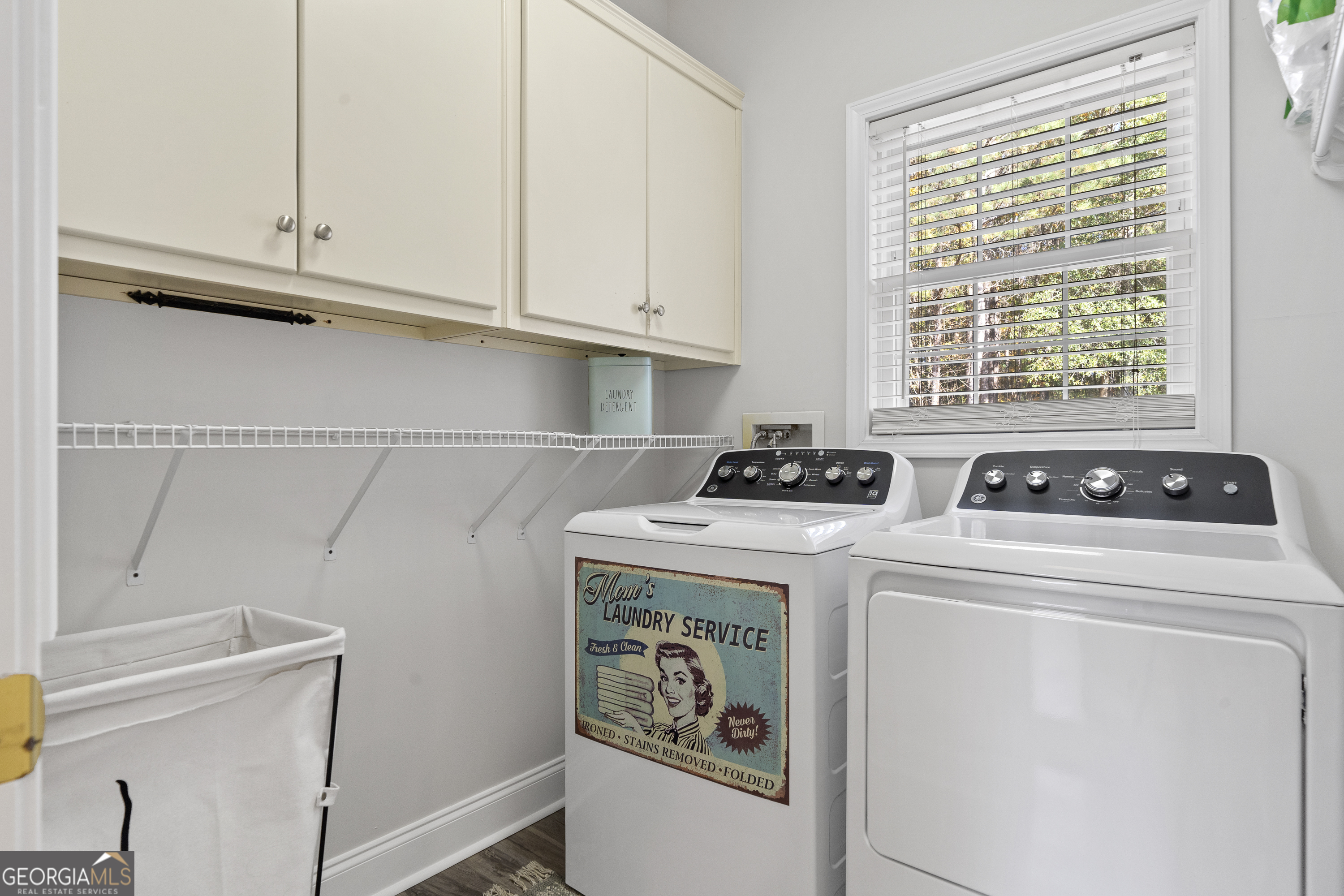 1050 Sugar Creek Church Road Madison, GA 30650 - Photo 29 of 60 a view of washer and dryer with kitchen view