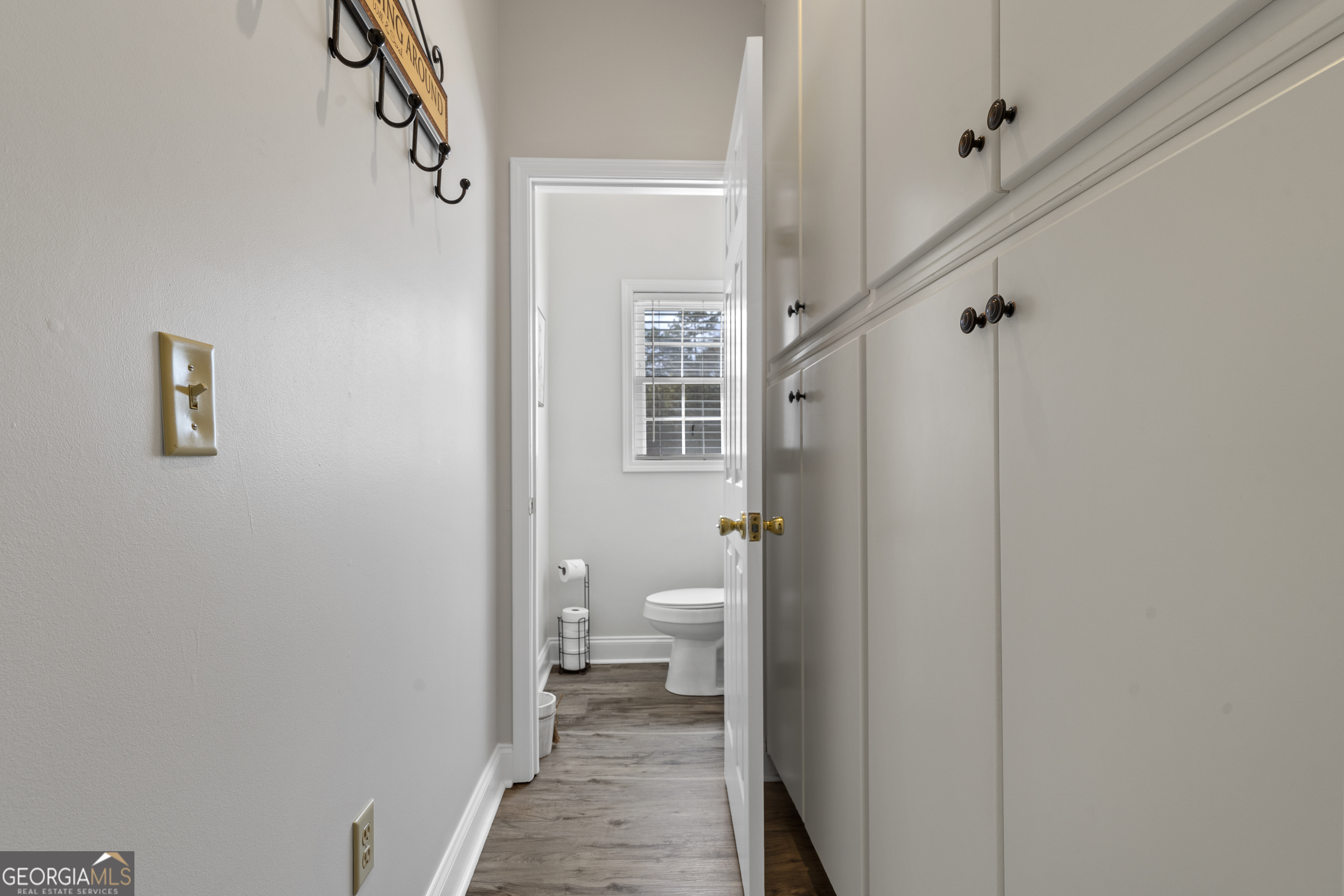 1050 Sugar Creek Church Road Madison, GA 30650 - Photo 30 of 60 a bathroom with a granite countertop toilet and a shower