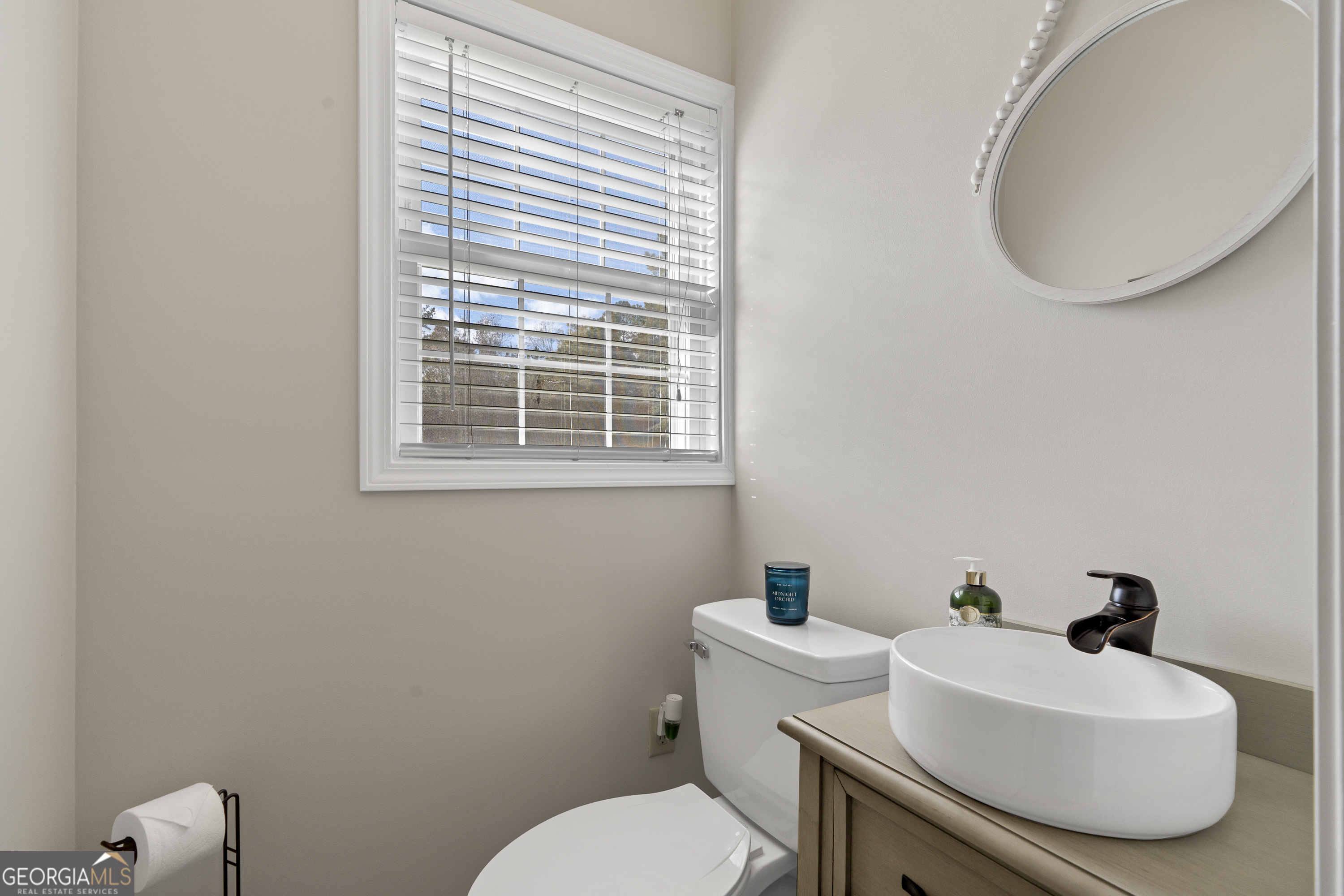 1050 Sugar Creek Church Road Madison, GA 30650 - Photo 32 of 60 a bathroom with a sink and a toilet