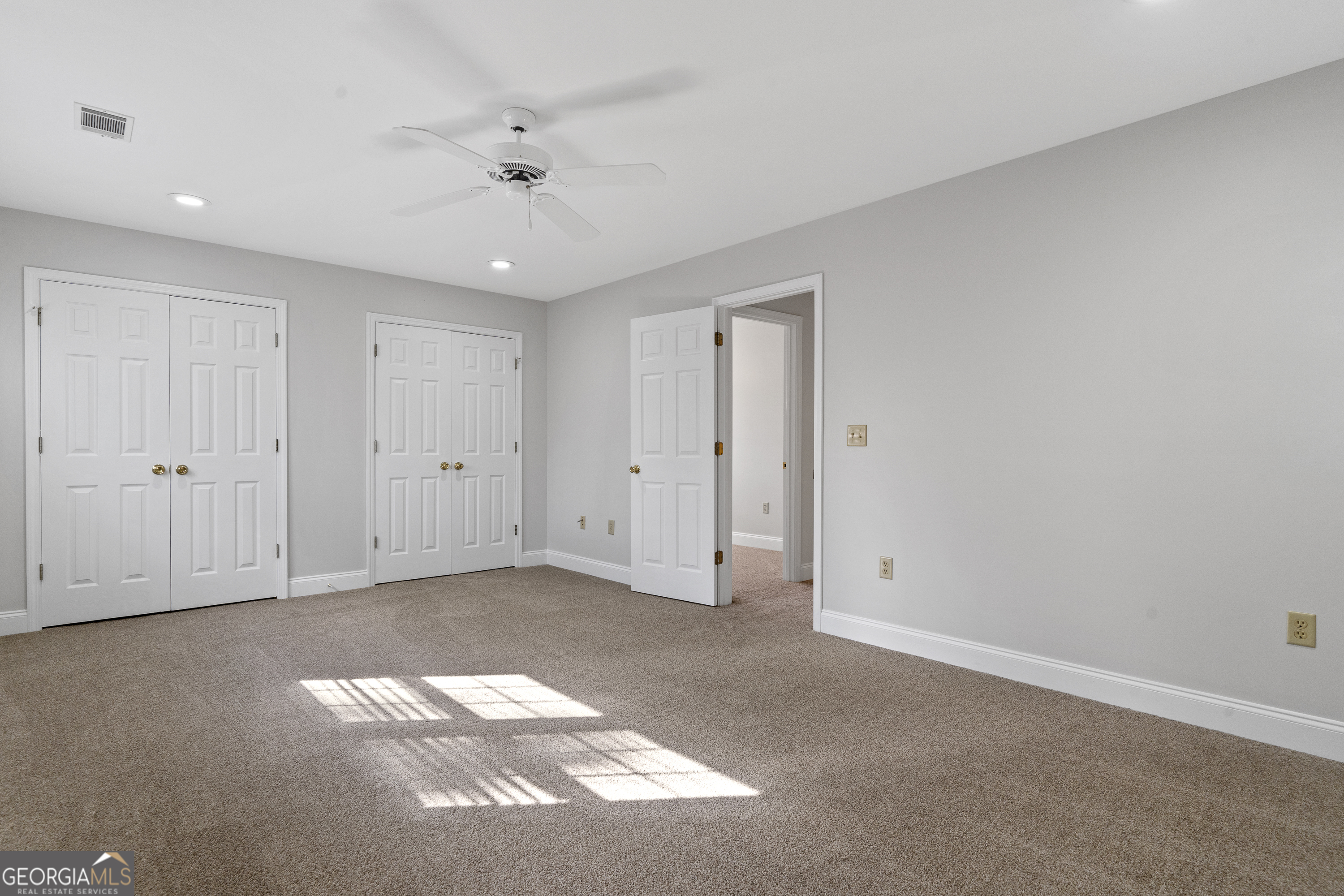 1050 Sugar Creek Church Road Madison, GA 30650 - Photo 36 of 60 a view of an empty room with a ceiling fan
