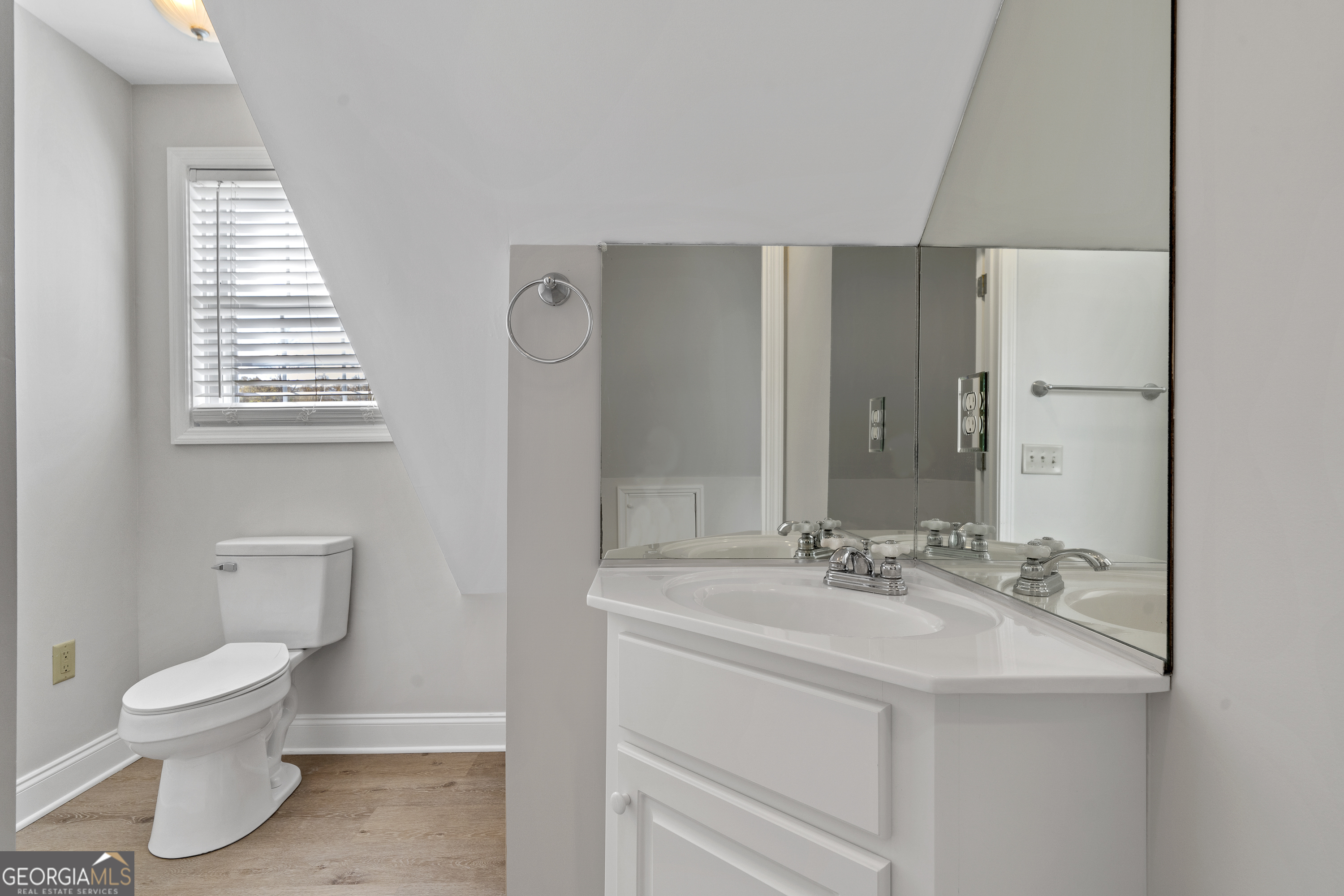 1050 Sugar Creek Church Road Madison, GA 30650 - Photo 49 of 60 a bathroom with a sink toilet and vanity