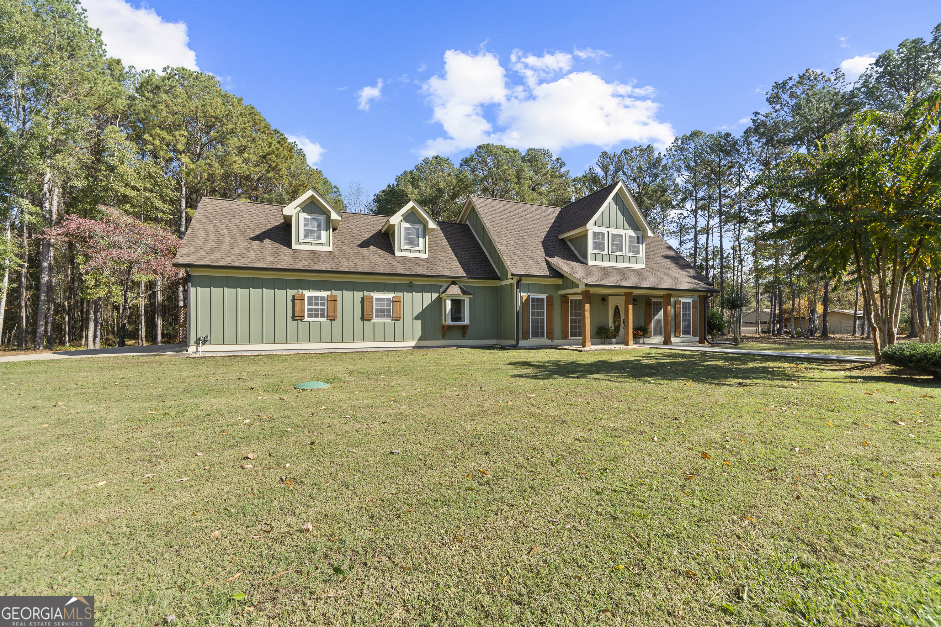 1050 Sugar Creek Church Road Madison, GA 30650 - Photo 60 of 60 a front view of a house with a garden