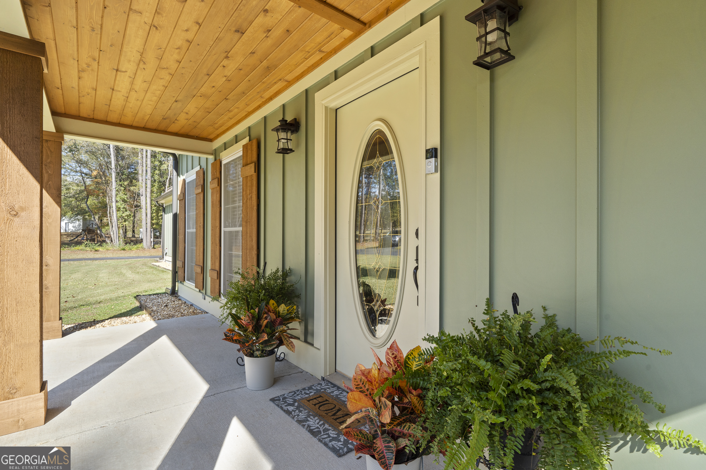 1050 Sugar Creek Church Road Madison, GA 30650 - Photo 7 of 60 a front view of a house with a garden