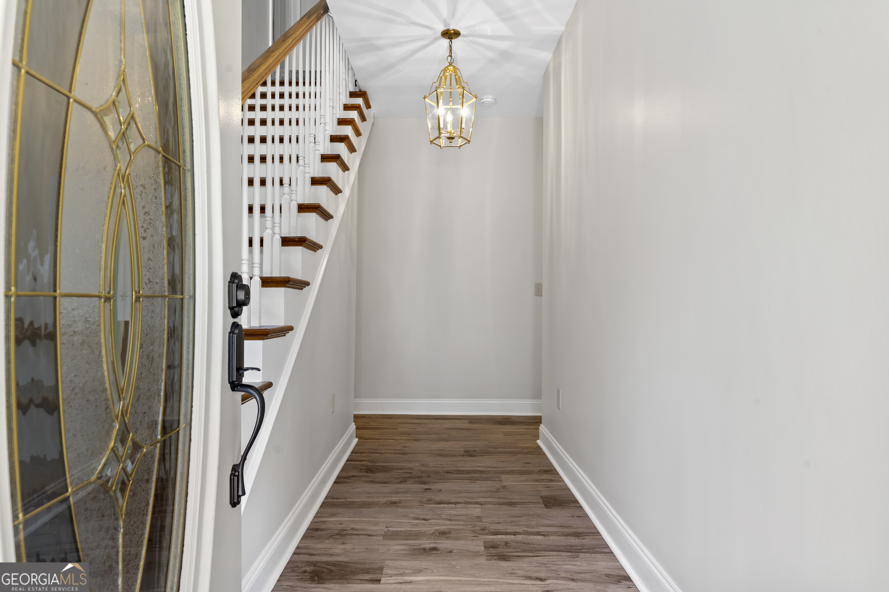 1050 Sugar Creek Church Road Madison, GA 30650 - Photo 8 of 60 a view of a hallway with wooden floor and entryway
