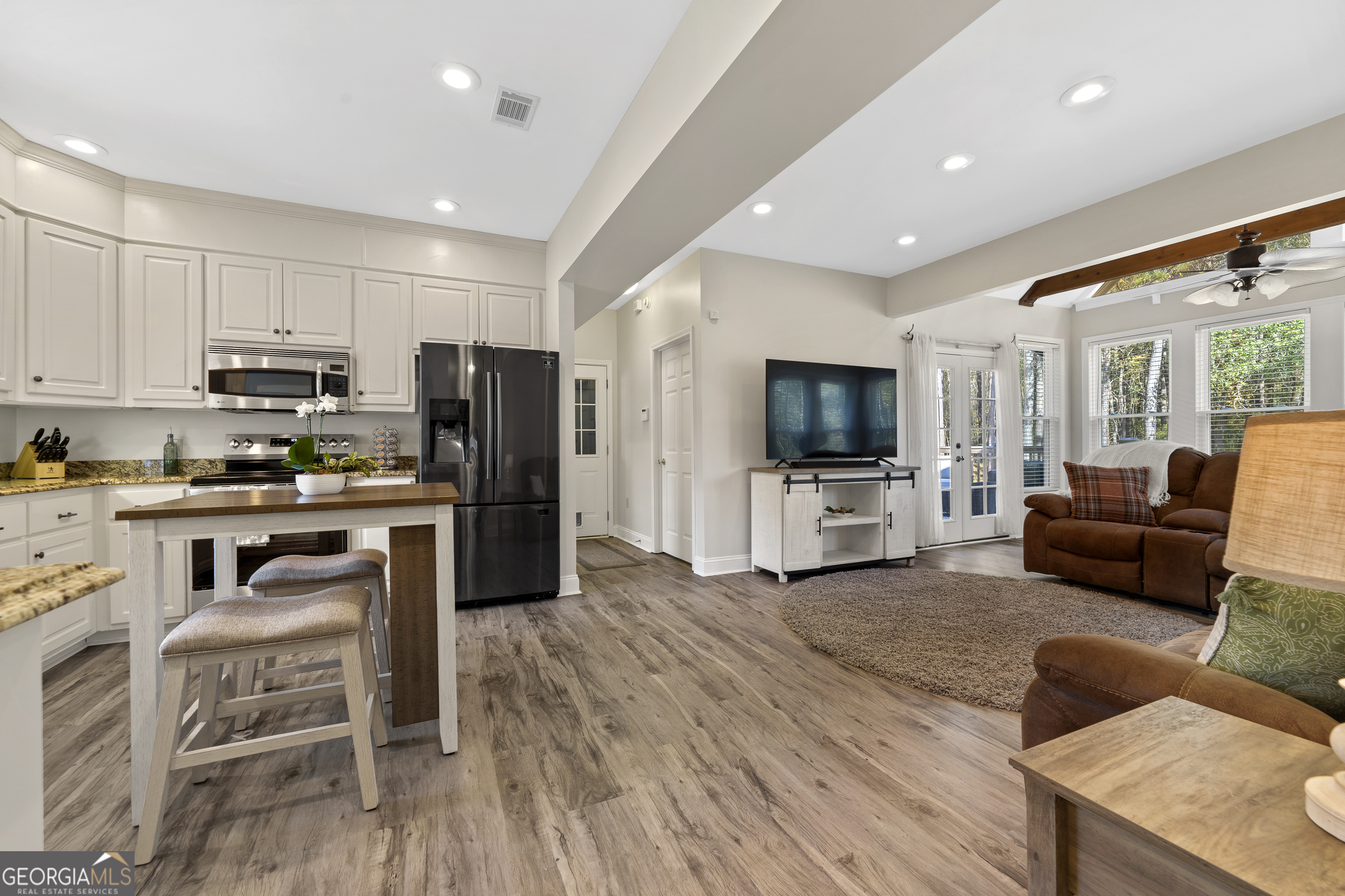 1050 Sugar Creek Church Road Madison, GA 30650 - Photo 10 of 60 a living room with furniture and a flat screen tv