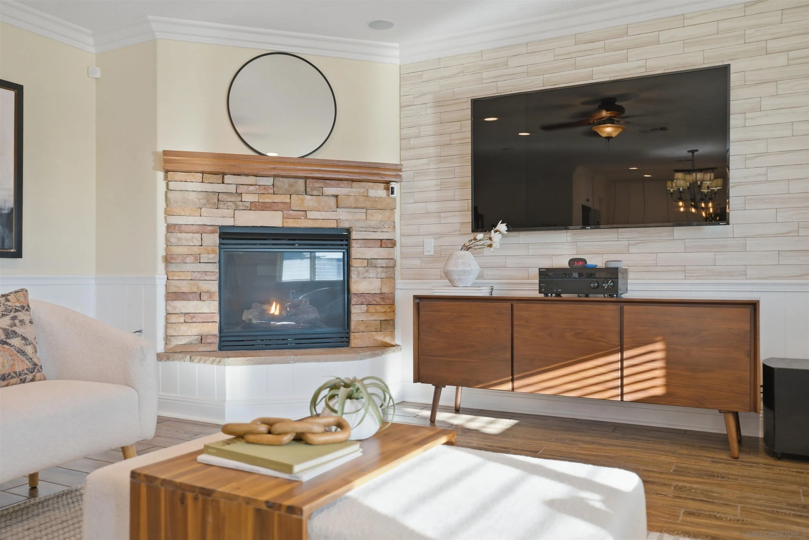 32892 Monte Drive Temecula, CA 92592 - Photo 14 of 60 a living room with furniture a mirror and a fireplace