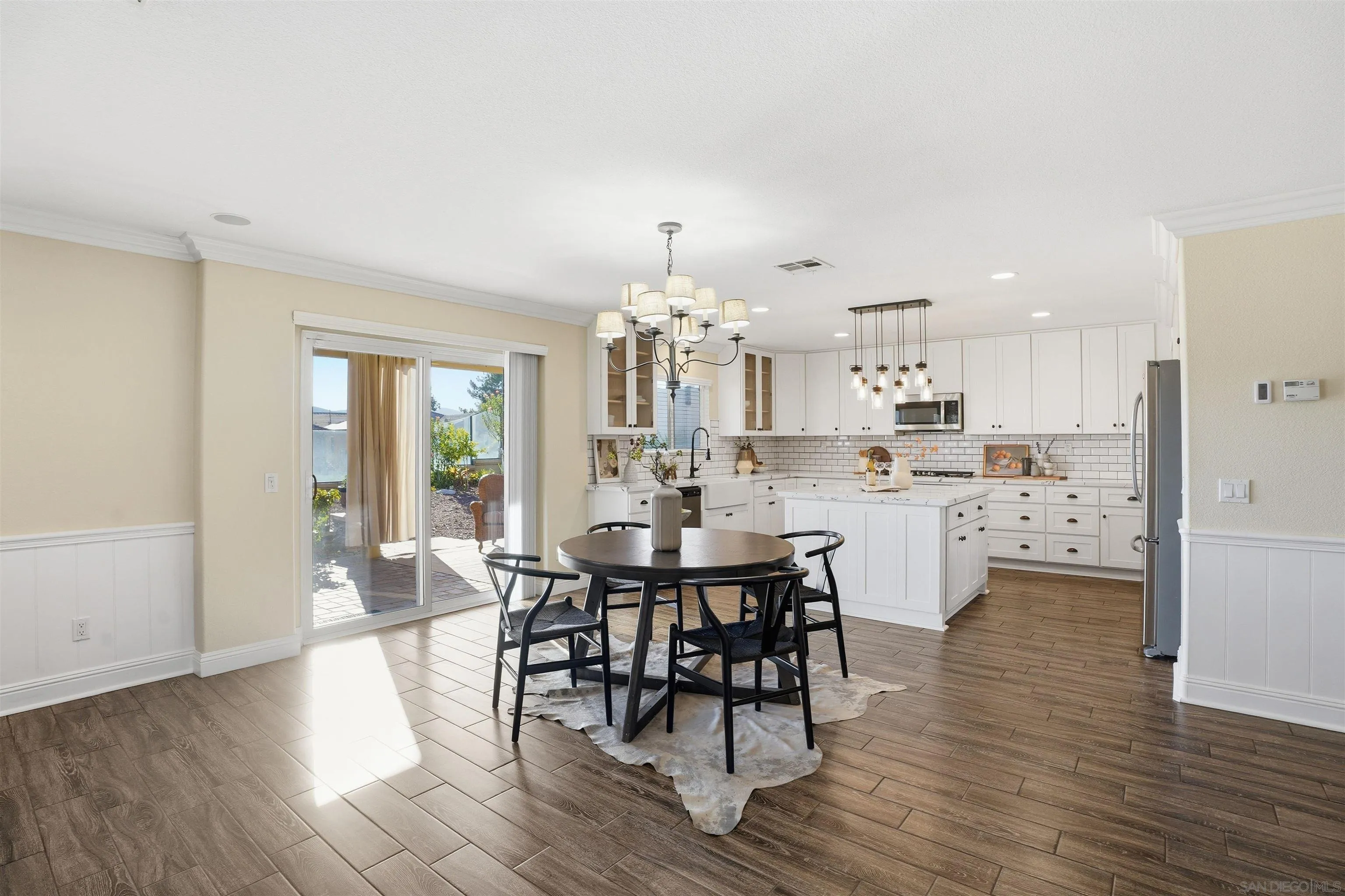 32892 Monte Drive Temecula, CA 92592 - Photo 17 of 60 a view of a dining room with furniture and wooden floor