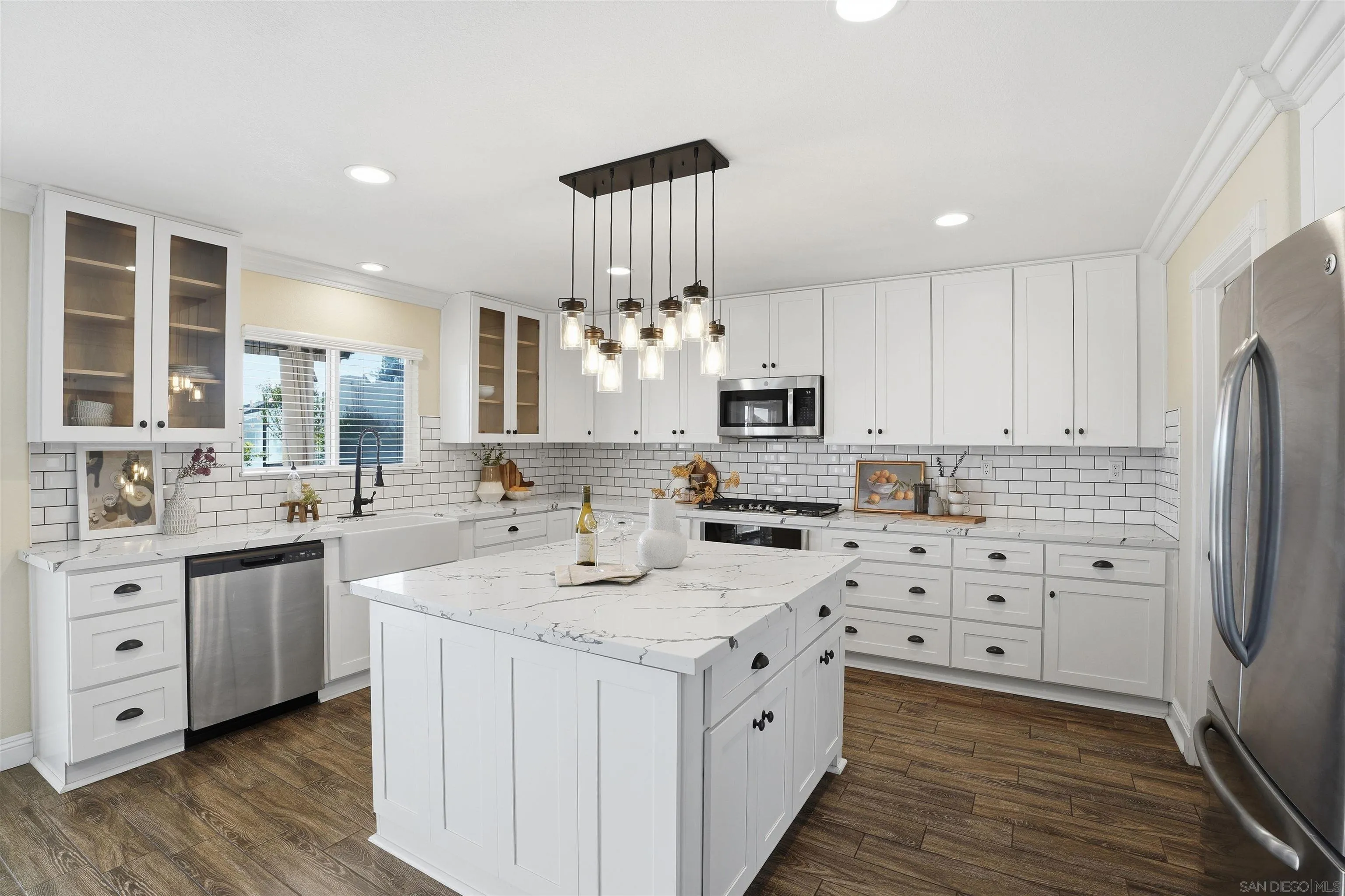 32892 Monte Drive Temecula, CA 92592 - Photo 22 of 60 a kitchen with granite countertop a sink stove and cabinets