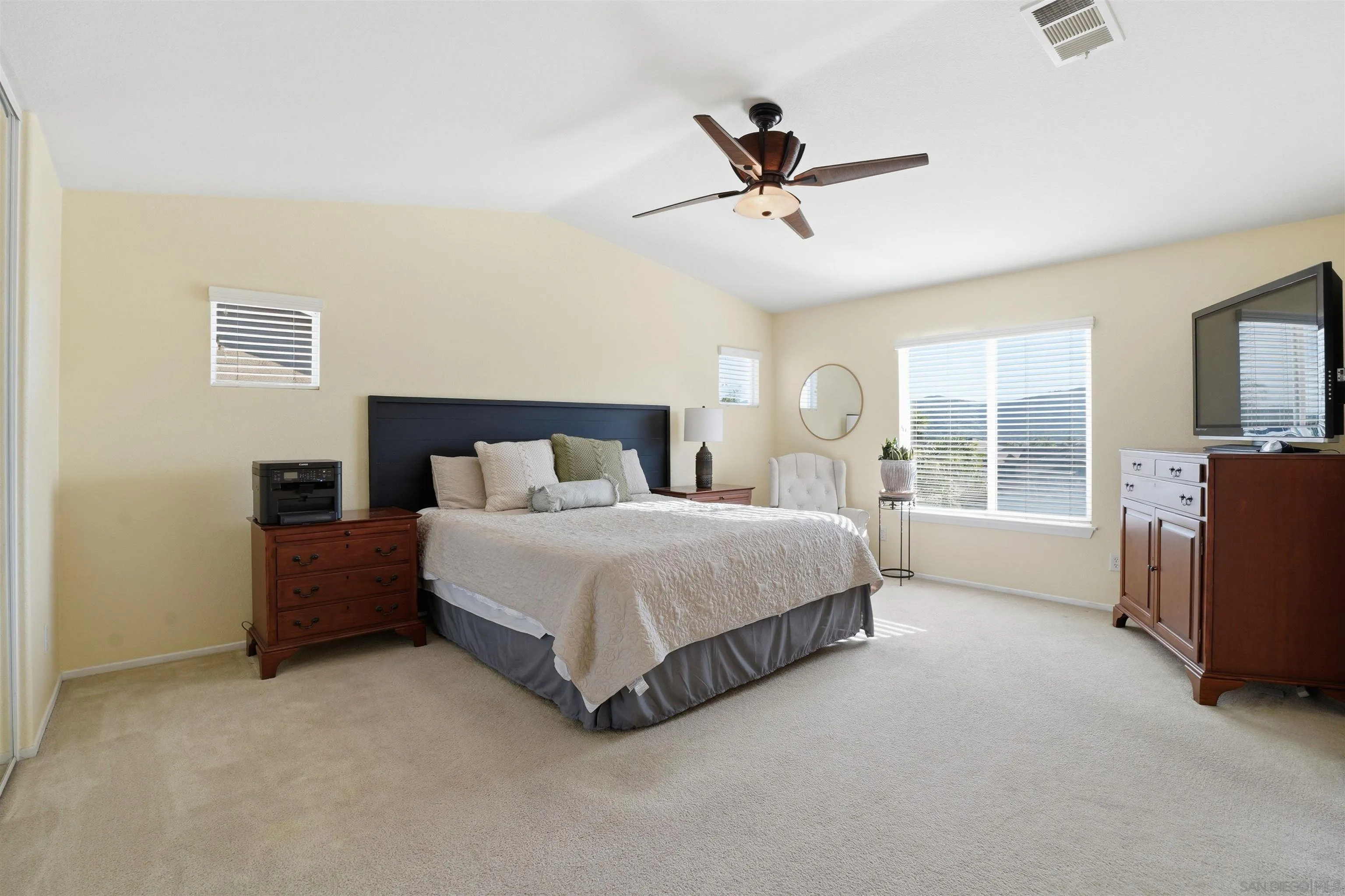 32892 Monte Drive Temecula, CA 92592 - Photo 32 of 60 a spacious bedroom with a bed dresser and a window