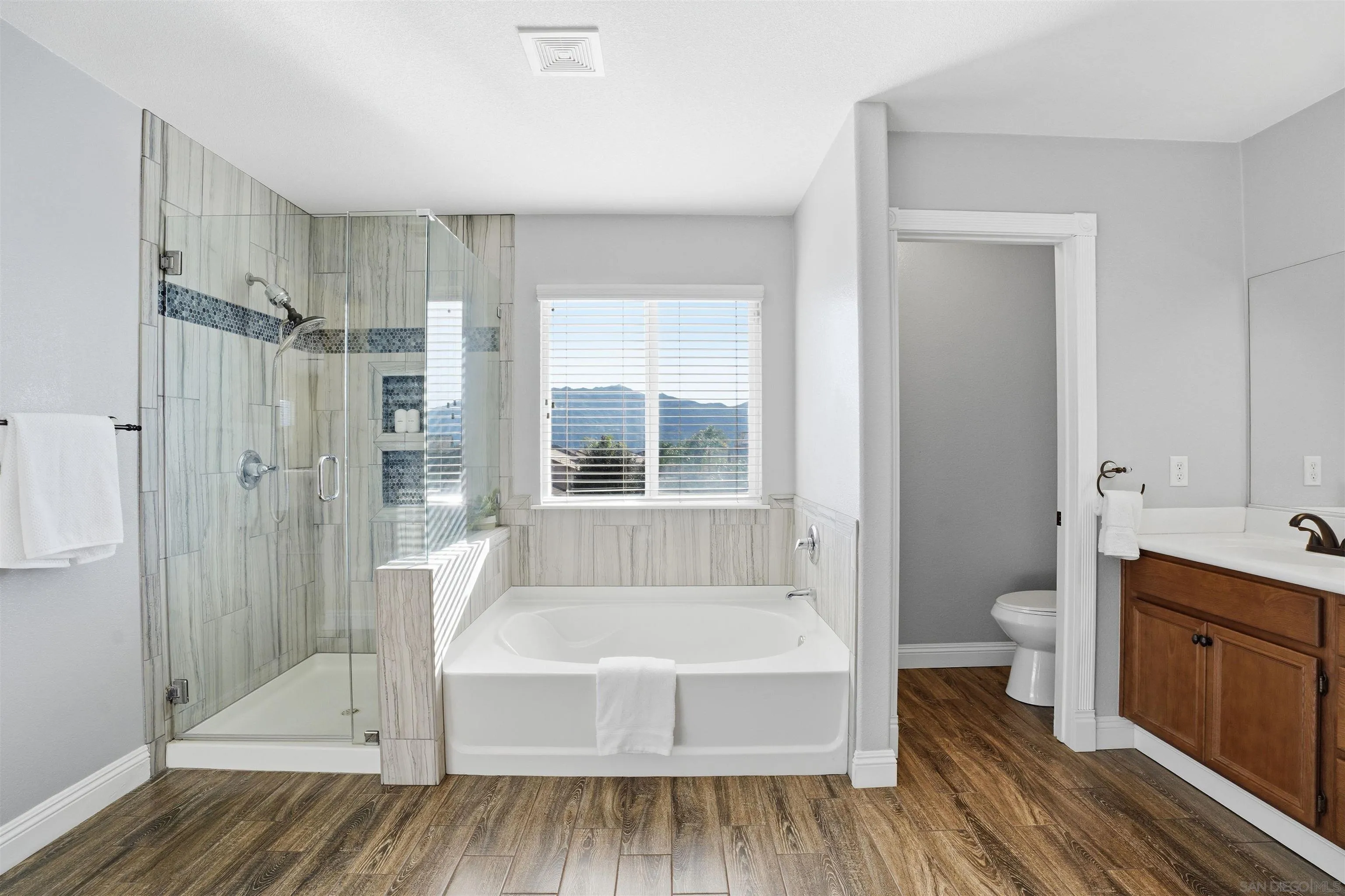 32892 Monte Drive Temecula, CA 92592 - Photo 36 of 60 a spacious bathroom with a tub shower and sink