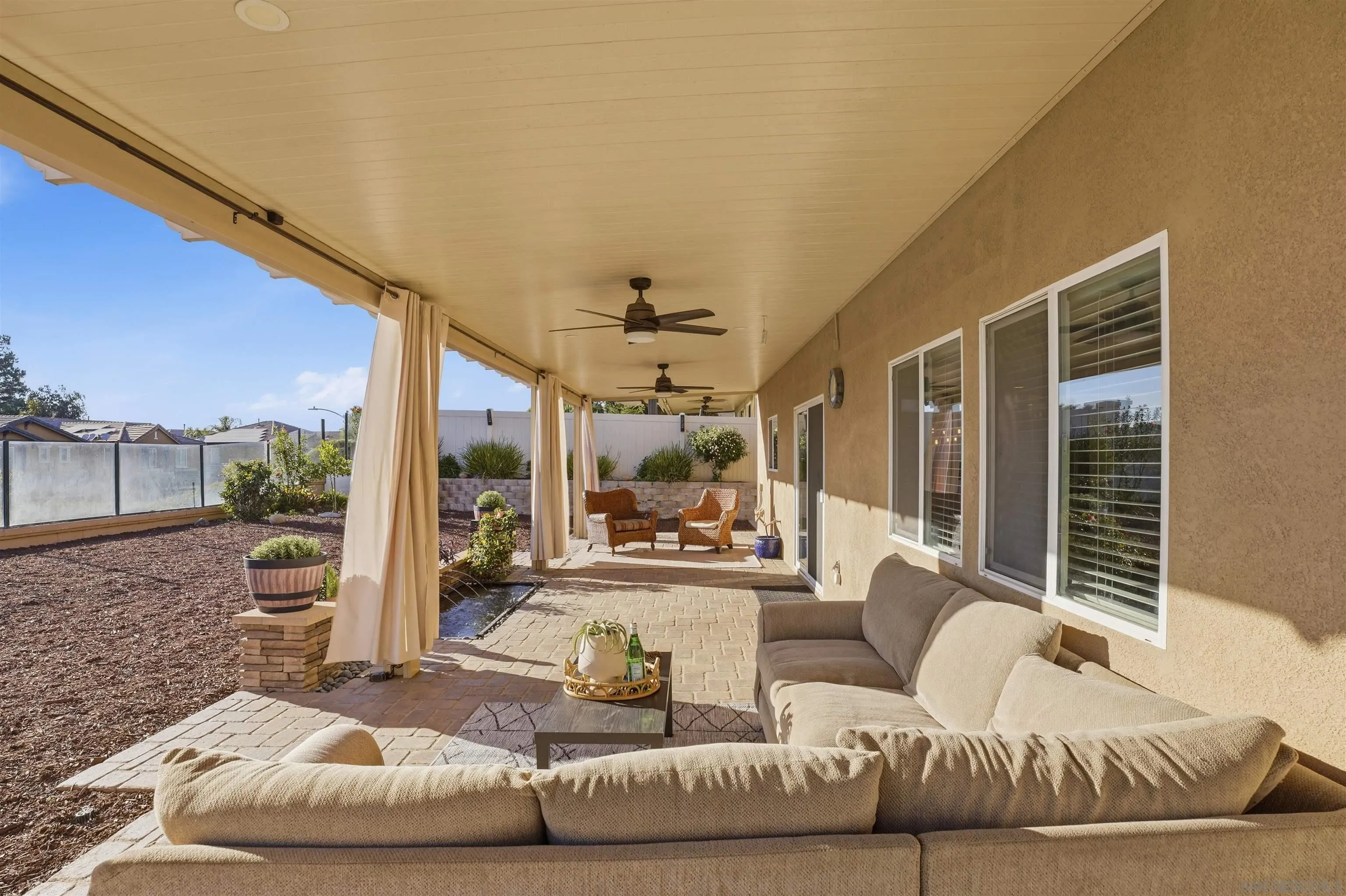32892 Monte Drive Temecula, CA 92592 - Photo 41 of 60 a living room with furniture and a large window