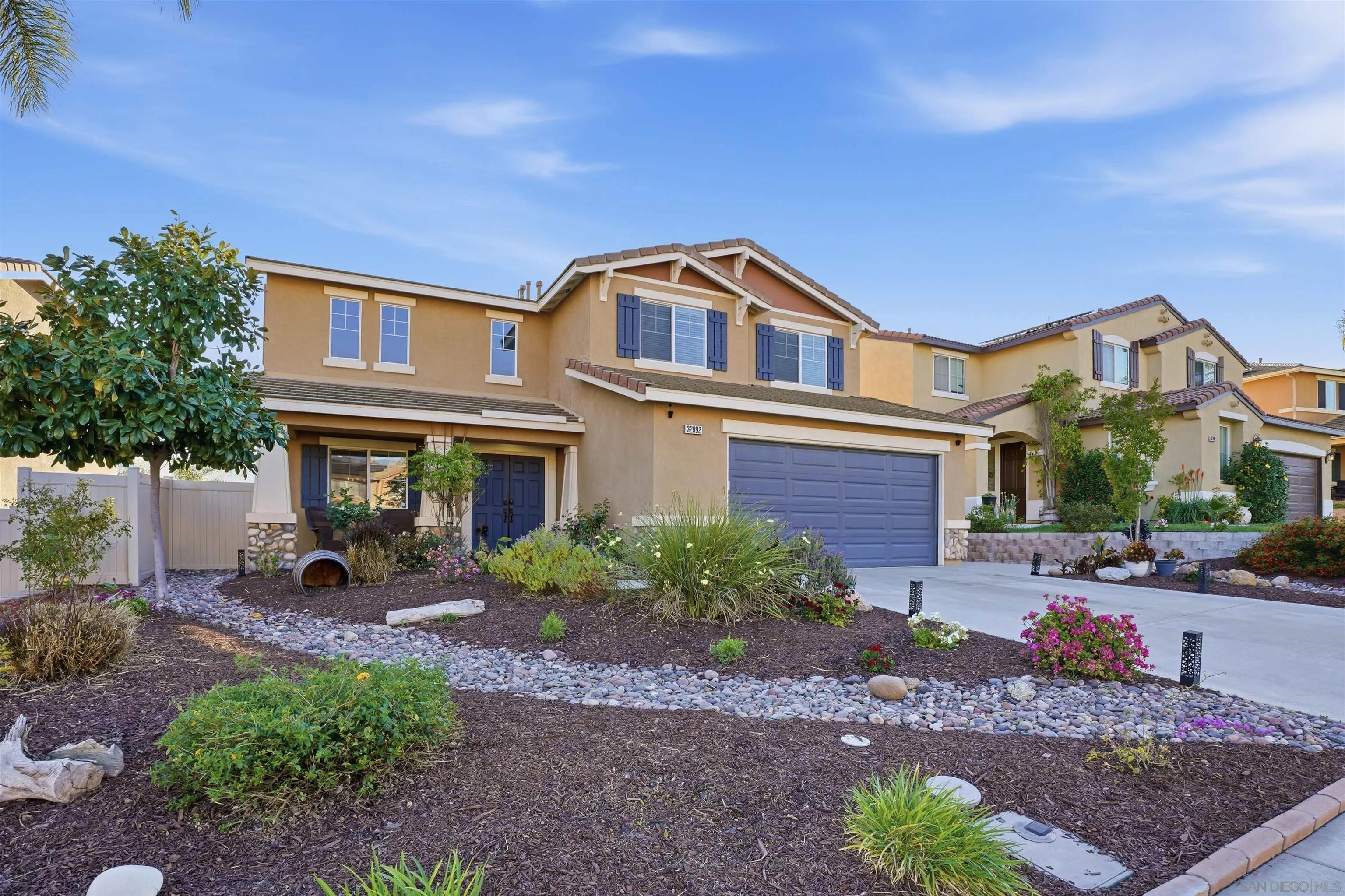 32892 Monte Drive Temecula, CA 92592 - Photo 44 of 60 a front view of a house with garden