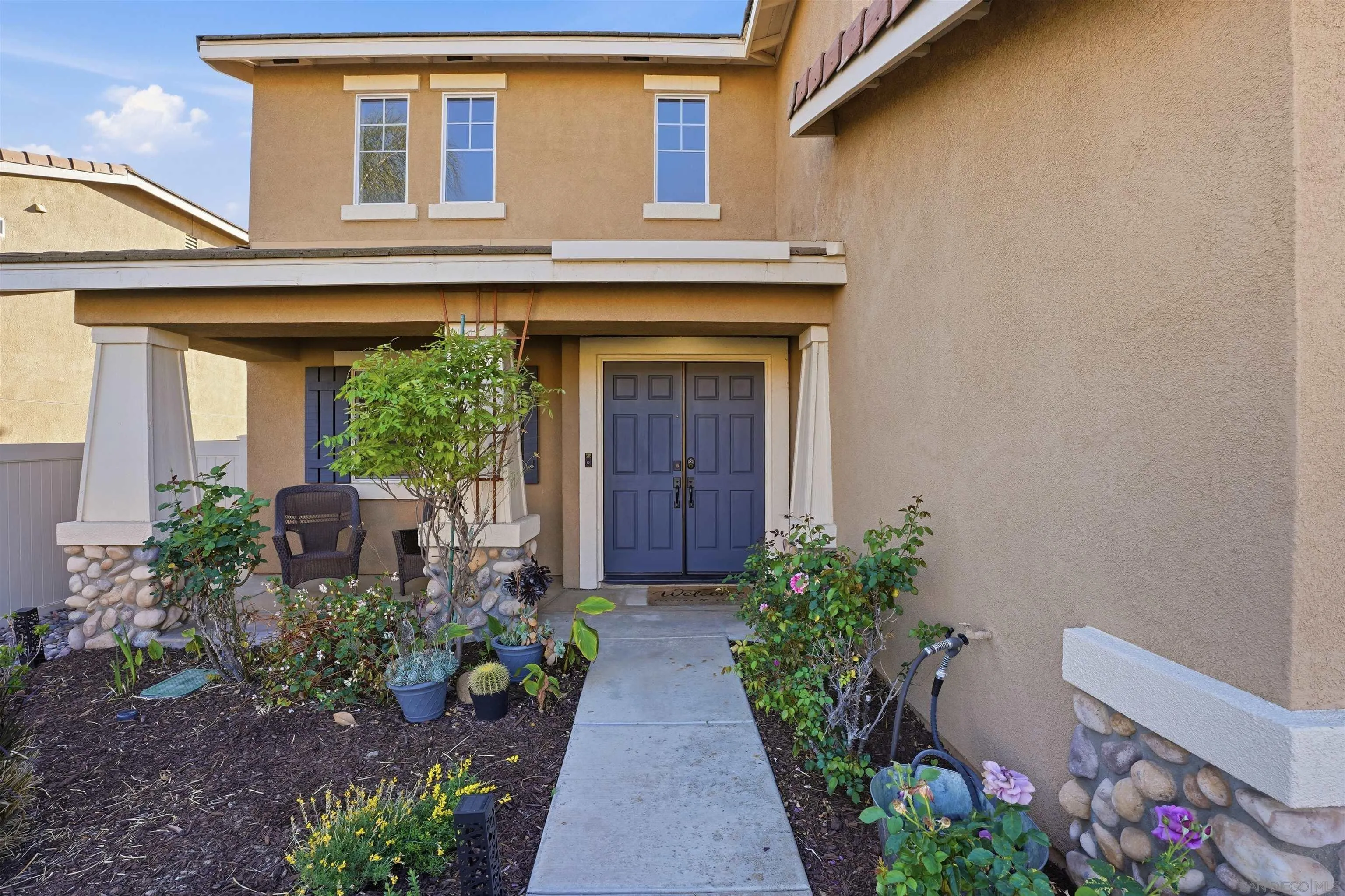 32892 Monte Drive Temecula, CA 92592 - Photo 46 of 60 a front view of a house with plants