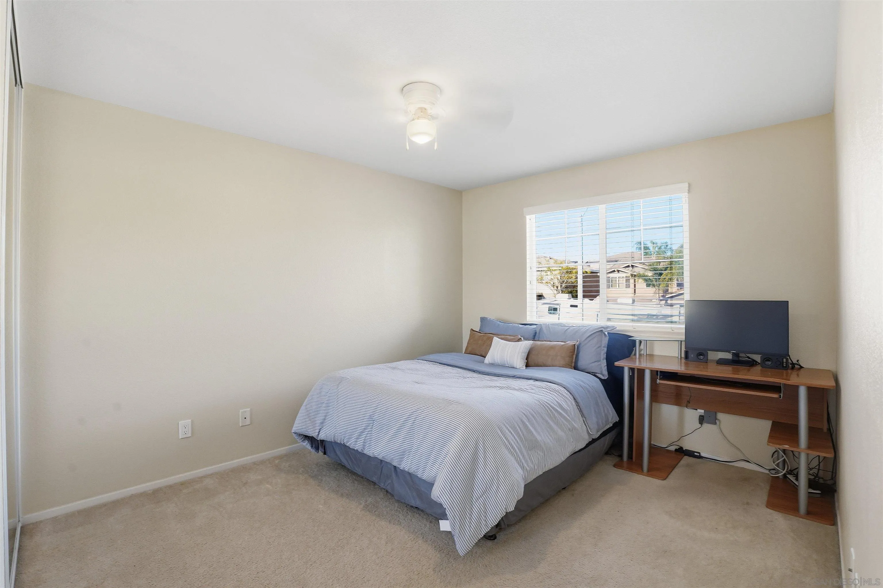 32892 Monte Drive Temecula, CA 92592 - Photo 55 of 60 a bedroom with a bed and a desk
