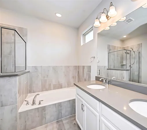 an empty room with windows and view of kitchen