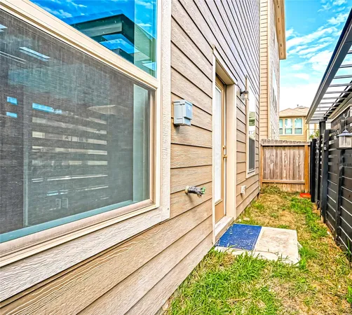 a view of a pathway of a house with backyard