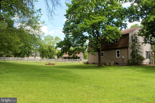 a view of field with trees in the background