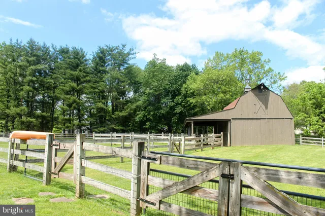 a dining room with furniture and a window