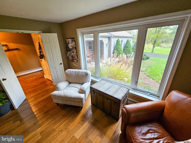 a view of a grassy field with trees