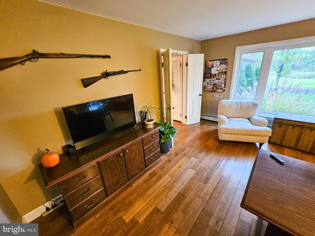 a view of a chairs and table in back yard of the house