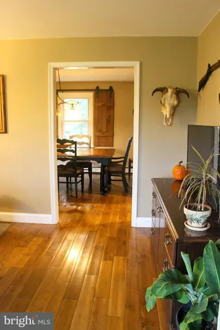 a view of a backyard of a house with lake view and sitting space