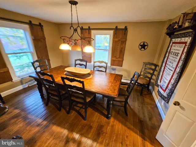 a view of a living room and floor to ceiling window or lake view