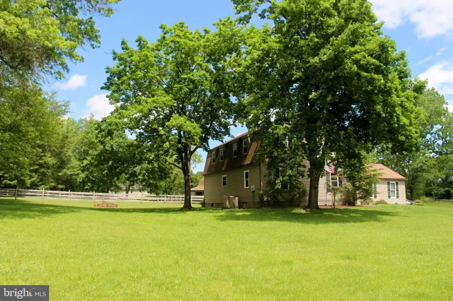 a view of a house with a big yard