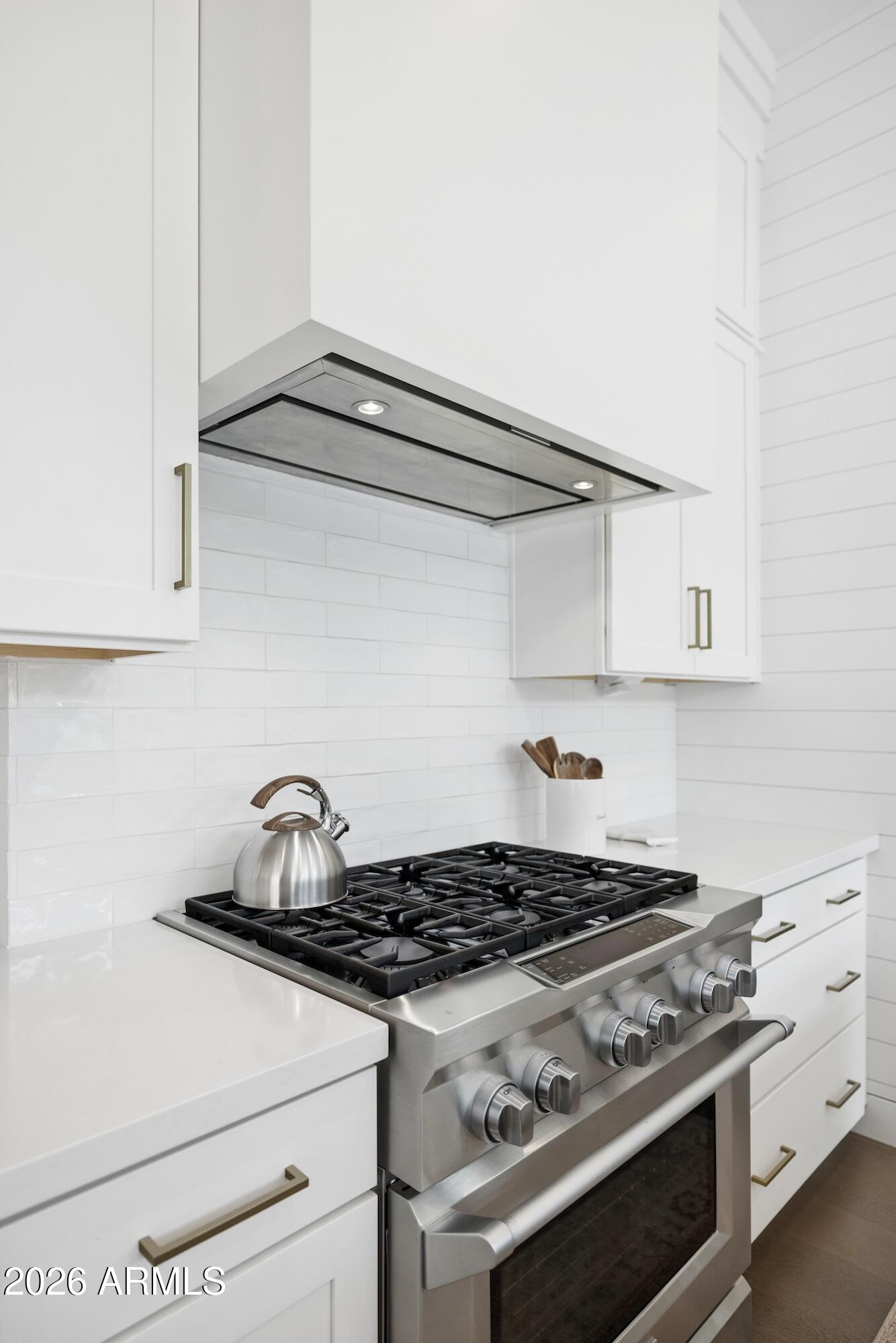 2633 East Geronimo Street Gilbert, AZ 85295 - Photo 19 of 75 a stove top oven sitting inside of a kitchen