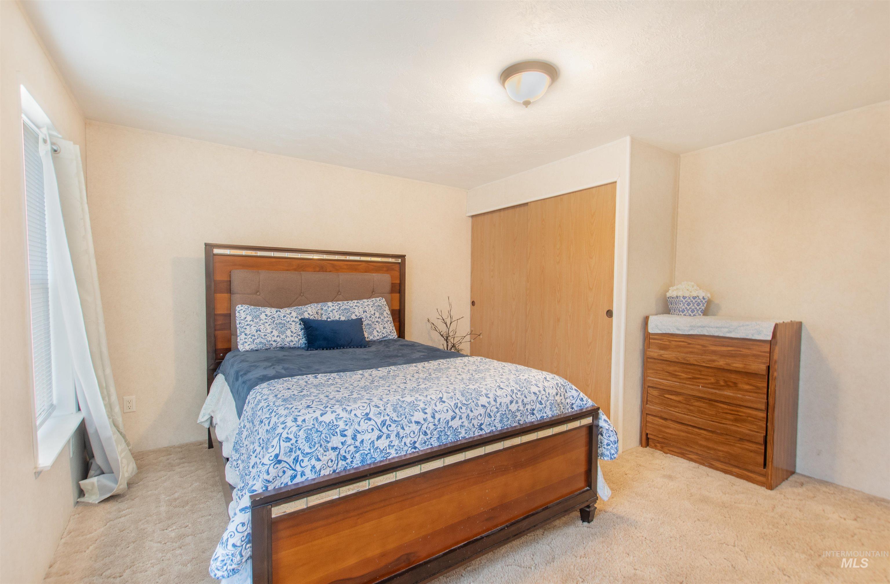 815 South Curtis Road, Unit 19 Boise, ID 83705 - Photo 12 of 25 Carpeted bedroom featuring a closet